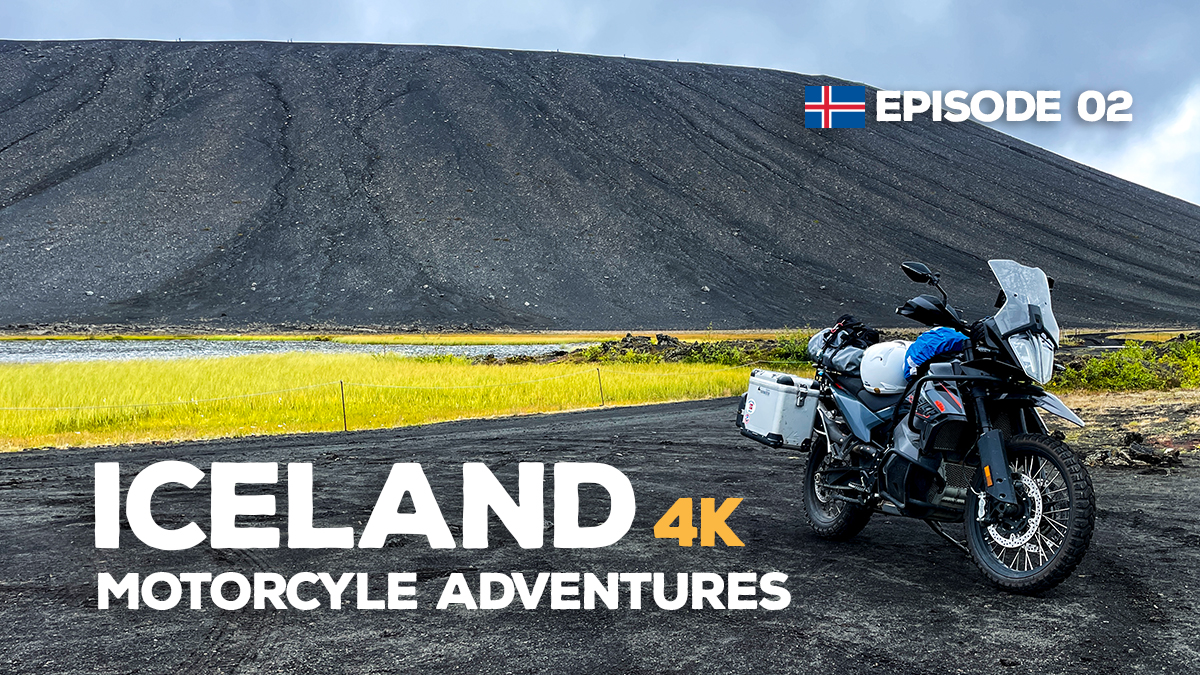 A picture of a KTM 890 Adventure motorcycle parked in front of the Hverfjall volcano in Iceland.