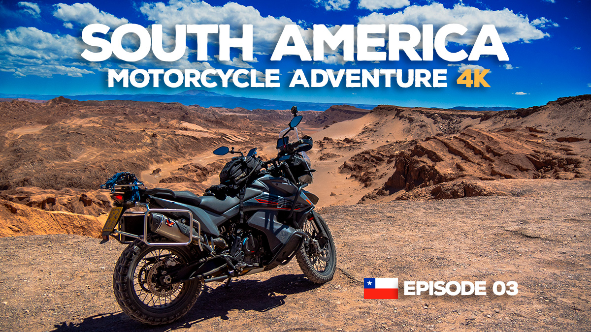 A photo of a KTM 890 Adventure motorcycle parked at a scenic point in the Atacama desert