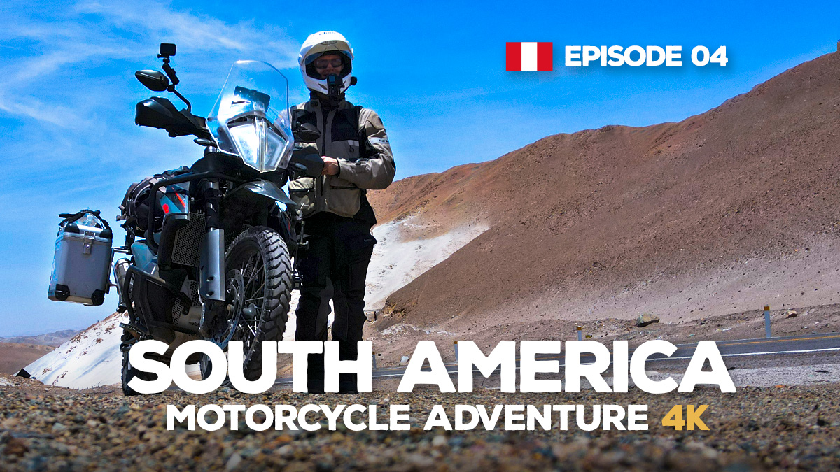 A photo of a man standing next to at KTM 890 Adventure motorcycle in Peru