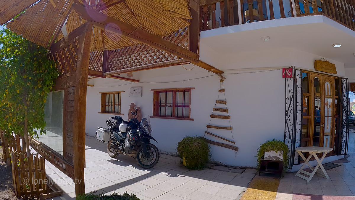 A view of a KTM 890 Adventure motorcycle parked outside a building