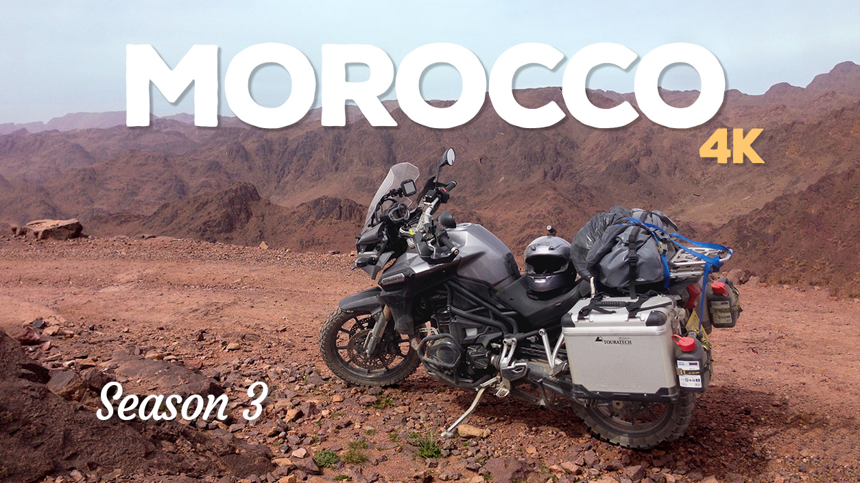 A photo of a motorcycle parked on a dirt track in the High Atlas Mountains in Morocco.